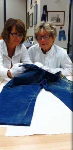 Barbara Hunter Kepon shows her daughter the 1890 waist overalls (pictured) she found in Southern California’s abandoned Calico Gold Mine. 