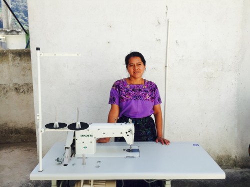 A Mercado Global artisan with her first sewing machine.
