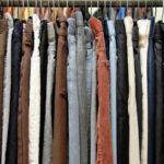 A rack of many Levi's® pants in various shades and textures.