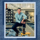 LS&Co. CEO Chip Bergh poses on a stool. The photo is overlayed on a denim texture background.