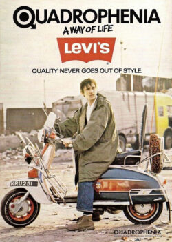 A movie poster for the 1979 film “Quadrophenia.” Protagonist Jimmy Cooper sits on a red scooter with his hands on the handlebar wearing a military fishtail parka and Levi's® 501® jeans. He is looking off towards the right. Text on the top of the poster reads in all caps: "Quadrophenia" followed by "a way of life" and the red Levi's® batwing logo. the text "quality never goes out of style" is under the logo.