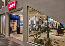 An angled photo of the exterior of the Levi's® Kyoto store, featuring a large slanted window and a Levi's® logo over the open doorway.