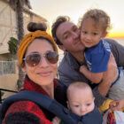VP of Marketing at Byond Yoga® Katie Babineau poses in a selfie with her husband and two young children.
