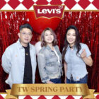 Christy Su, LS&Co.'s new general manager of Taiwan and Hong Kong, poses at a holiday party with two other LS&Co. employees in front of a shiny red streamer background. There is a designed red and white border around the photo featuring the Levi's® logo at the topand the words "TW Spring Party" on a gold rectangle at the bottom.