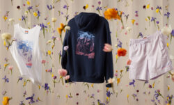 A white Dockers® tank with a floral design in blue and pink; the back of a black Dockers® hoodie with a floral design in blue and pink; a pair of pale pink Dockers® shorts, all from the Dockers® 2024 Pride collection, photographed in front of a cream background with falling flowers.