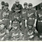 A black and white image of an early LS&Co. employee baseball team, Elesco. Players wear matching uniforms and hats.