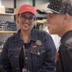 Levi’s® senior stylist Siti Fadillah stands in a Levi's® store and smiles at another employee