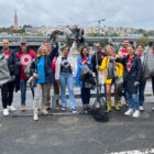 A group of LS&Co. employees pose with clean up supplies as they volunteer on LS&Co.'s annual Community Day 2024