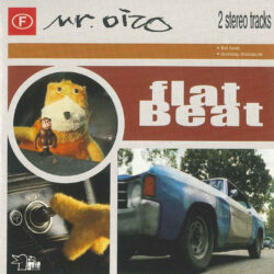 A CD cover featuring images of "Flat Eric," a yellow plush puppet, driving in a car. The CD is titled "flat beat"