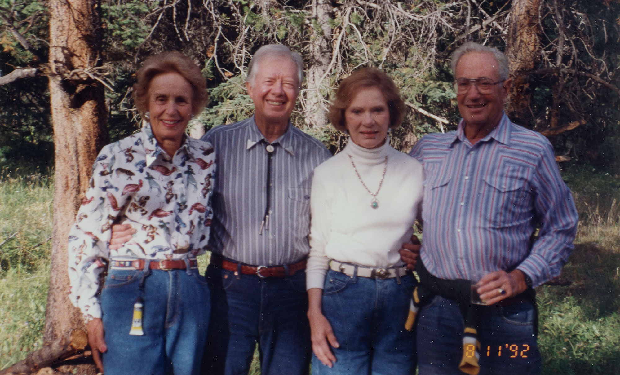 Former United States President Jimmy Carter and his wife Roselynn pose with former LS&Co. Chairman Walter Haas and his wife at Walter's ranch in Montana.