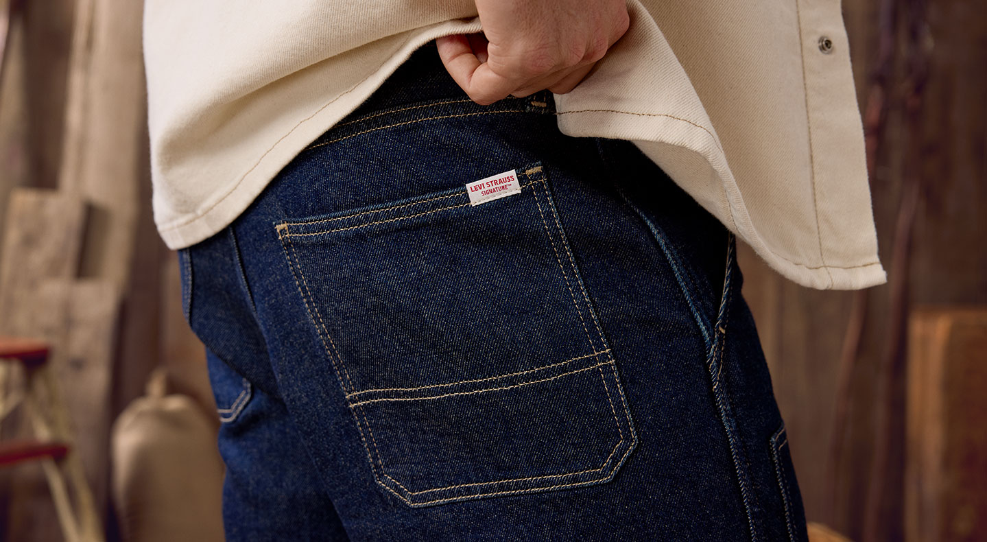 A close up shot of the back pocket of a person wearing Levi Strauss Signature dark was jeans