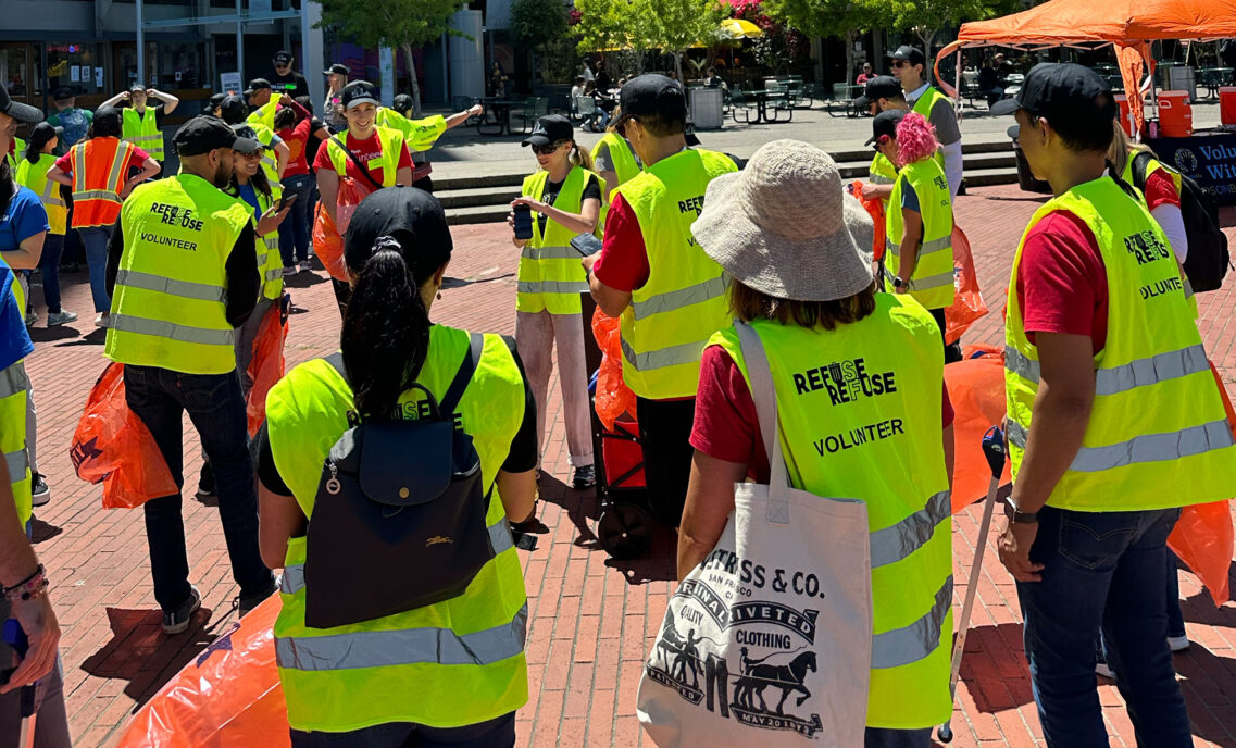 LS&Co. employee volunteers wearing high-vis safety vests gather and await volunteer instructions