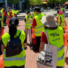 LS&Co. employee volunteers wearing high-vis safety vests gather and await volunteer instructions